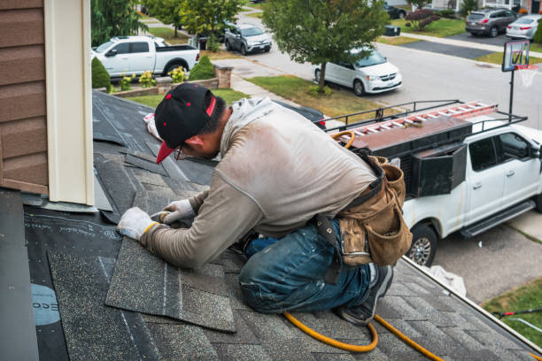 Professional Storm Damage Roof Repair technician working in Holly Springs, NC